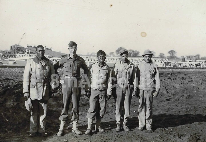 Capt. Smith and unnamed members of the 859th Battalion prepare to assemble a T2 Hangar at Eye. (Hallock Collection)
