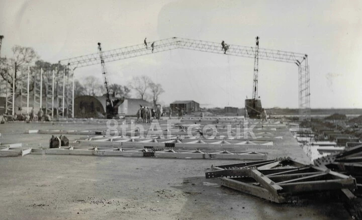 Dangerous work for the men of the 859th Engineer Battalion erecting the first posts for the T2 Hangar No. 1 at Eye (Hallock Collection) 