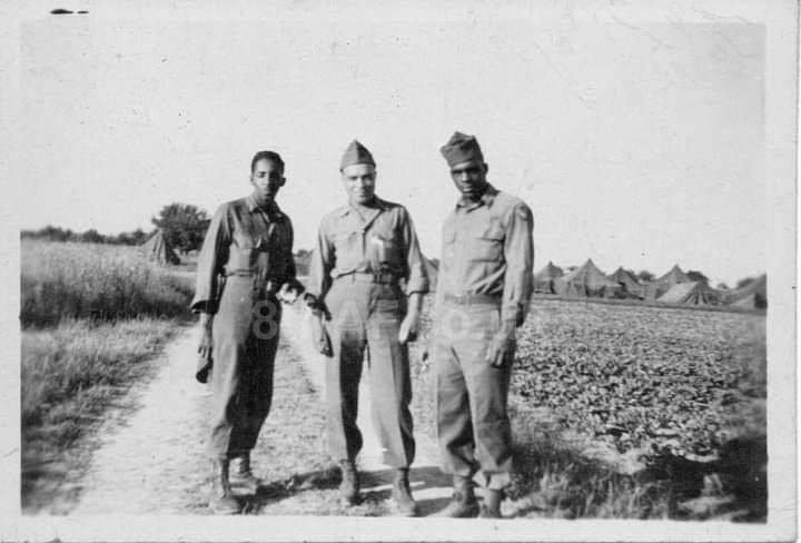 Tec 5 Alfredo Guitano (centre) of the 847th HQ & HS Company with two unknown comrades. The photo is believed to have been taken at the 847th's camp at Oakley Park at some point during 1944 (Guitano Family Collection)