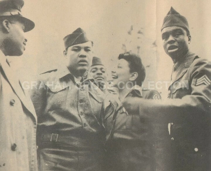 The famous heavyweight boxer, Joe Louis, visited the 923rd at Haughley Park on June 11, 1944.